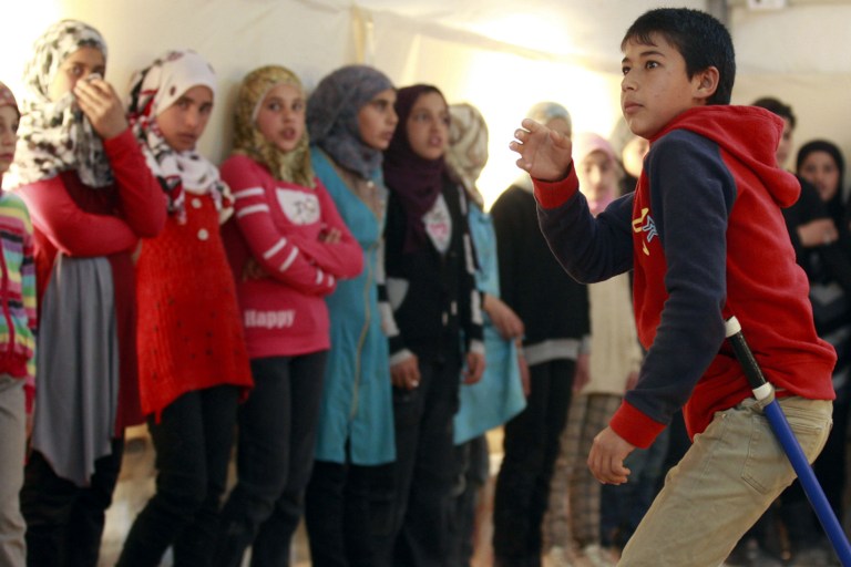 Syrian refugee children at a rehearsal of King Lear, at the Zaatari camp in Jordan, March 8, 2014 (photo credit: AFP/Khalil Mazraawi)