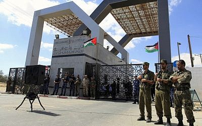 Members of Hamas' security forces standing guard in front of the Rafah border crossing with Egypt in the southern Gaza Strip, September 16, 2013. (photo credit: AFP PHOTO/SAID KHATIB)