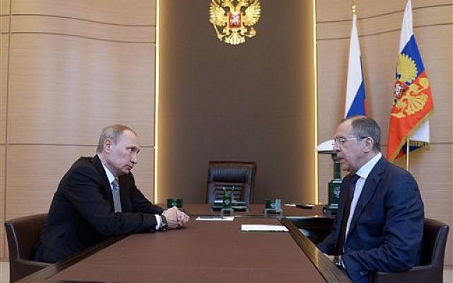 Russian President Vladimir Putin, left listens to Foreign Minister Sergey Lavrov, right, during their meeting at the Bocharov Ruchei residence in Sochi, southern Russia, Monday, March 10, 2014.  (photo credit: ap/RIA-Novosti, Alexei Nikolsky, Presidential Press Service)