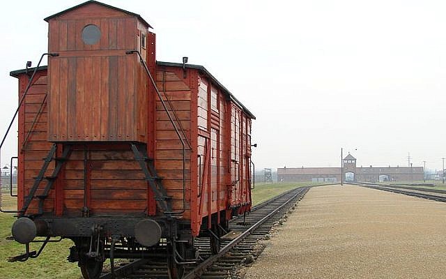 An original railway carriage stands at the Judenrampe platform at Auschwitz (Adam Jones/Wikimedia Commons)