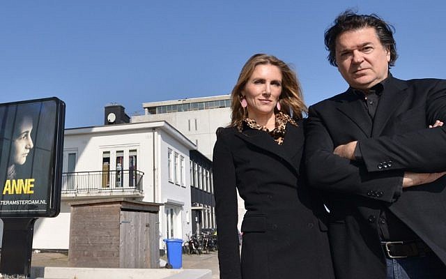 Leon de Winter and Jessica Durlacher stand outside the Amsterdam theater that is being built as a venue for their play on March 12, 2014. (Cnaan Liphshiz/JTA)