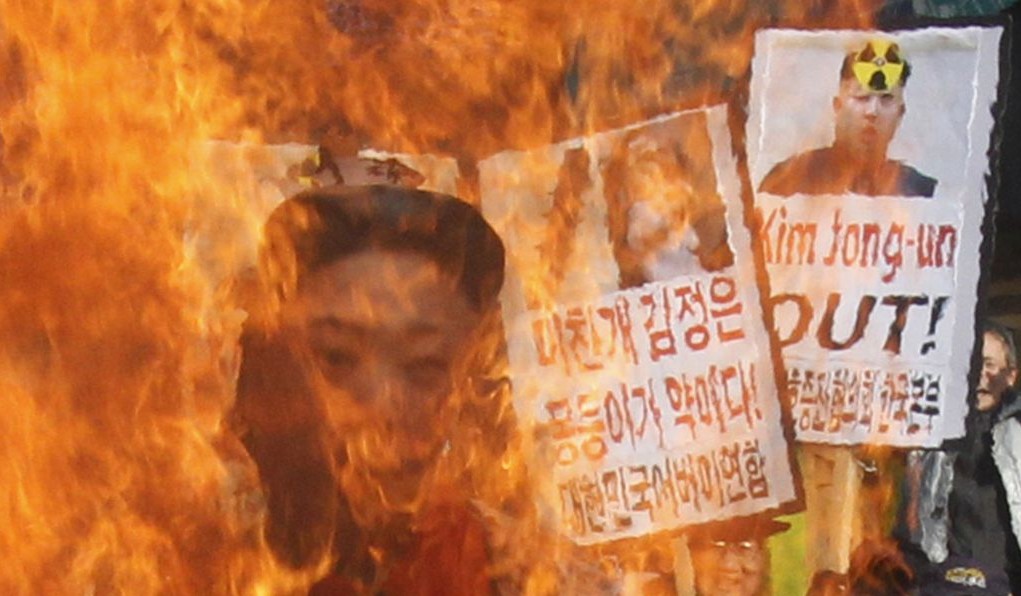 South Korean protesters burn an effigy of North Korean leader Kim Jong Un during an anti-North Korea rally to denounce North Korea's nuclear test in February 2013.  (photo credit:AP Photo/Ahn Young-joon, File)