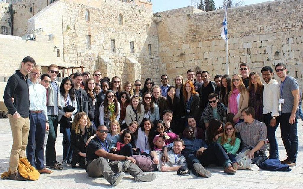 The CJP will continue as a willing and enthusiastic sponsor of the Harvard Student Israel Trek. Trek participants posing at the Western Wall, March 2014. (Photo: Zachary Hodges)