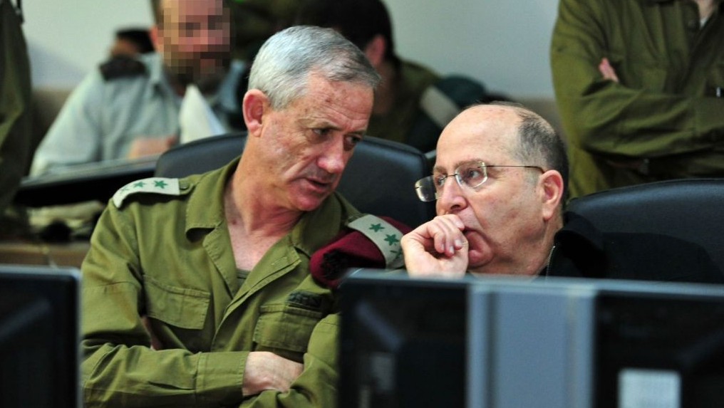 IDF Chief of Staff Benny Gantz confers with Defense Minister Moshe Ya'alon at the Navy war room during Wednesday morning's operation by naval commandos  during which they captured a Iranian shipment of weapons on its way to Gaza (photo credit: Ariel Hermoni/ Ministry of Defense)