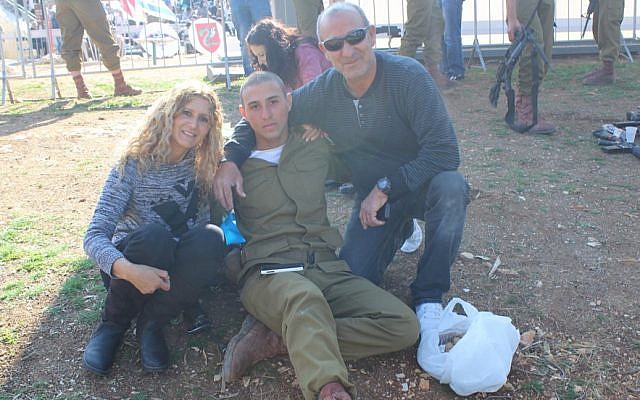 As did many families, Yaela and Avi Elimelech brought homemade cookies for their son, Idan, during the Feb. 18 ceremony at Ammunition Hill during which dozens of paratroopers received their red berets. (The Times of Israel/Rebecca McKinsey)