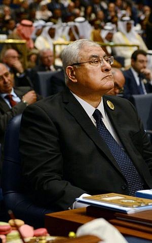 Interim President of Egypt Adly Mansour, listens during the opening session of the Arab League Summit in Bayan Palace, Kuwait City, Tuesday, March 25, 2014.  (photo credit: AP/Nasser Waggi)
