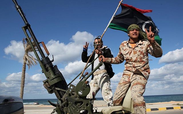 Libyan militias from towns throughout the country's west parade through Tripoli, Libya, on February 14, 2012. (photo credit: AP/Abdel Magid Al Fergany, file)