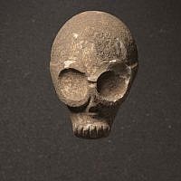 Skull mask/statue, Provenance unknown, Southern slopes of the Judean hills, Pre-Pottery Neolithic B, 9,000 years old. (photo credit: Elie Posner/Israel Museum, Jerusalem)