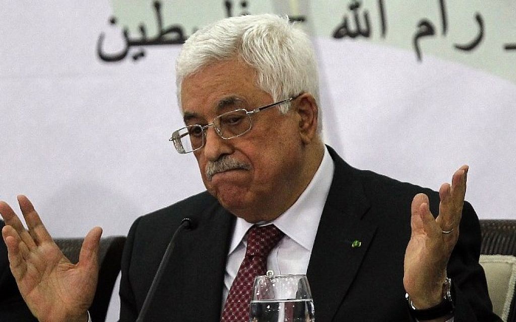 File: Palestinian Authority President Mahmoud Abbas gestures during a meeting with the Palestine Liberation Organization's Central Council in the West Bank city of Ramallah, on April 26, 2014. (AFP/Abbas Momani)