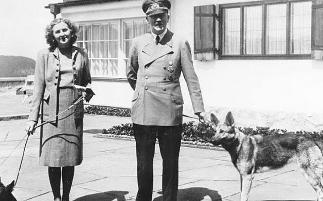 Adolf Hitler and Eva Braun walking their dogs, 1942. (German Federal Archive)