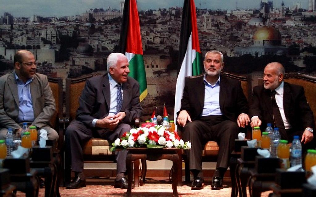 Hamas and Fatah leaders met in Gaza for talks on Palestinian reconciliation on April 22, 2014. (l-r) Hamas leader Moussa Abu Marzouk, Fatah official Azzam Al-Ahmed, head of the Hamas government Ismail Haniyeh, and deputy speaker of the Palestinian Parliament Ahmed Bahar (Abed Rahim Khatib/Flash90)