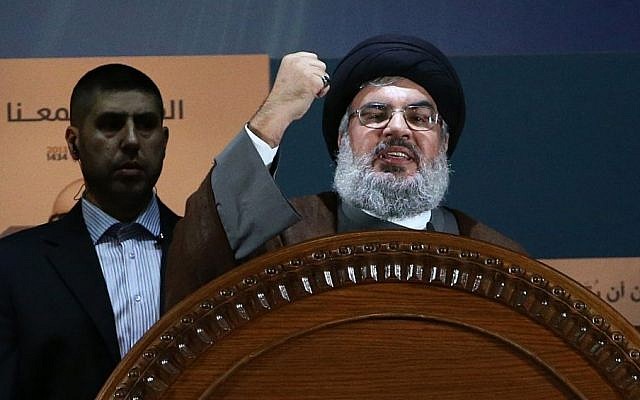 In this August 2, 2013 file photo, Hezbollah leader Sheikh Hassan Nasrallah speaks during a rally to mark Jerusalem day, or Al-Quds day, in the southern suburb of Beirut, Lebanon. (AP Photo/Hussein Malla)
