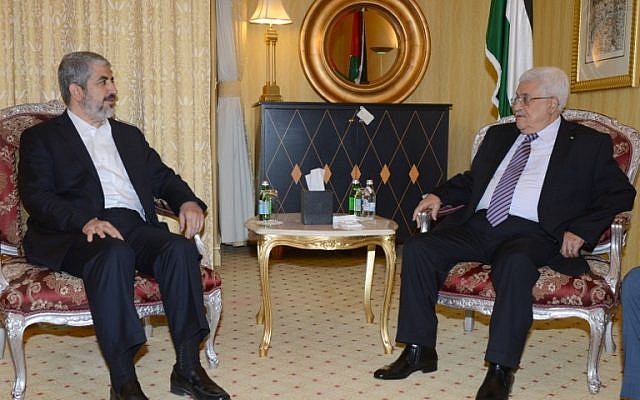 Palestinian leader Mahmoud Abbas, right, meeting with political bureau head of Hamas, Khaled Meshaal on May 5, 2014 in Doha, Qatar. (photo credit: AFP/ PPO/THAER GHANAIM)
