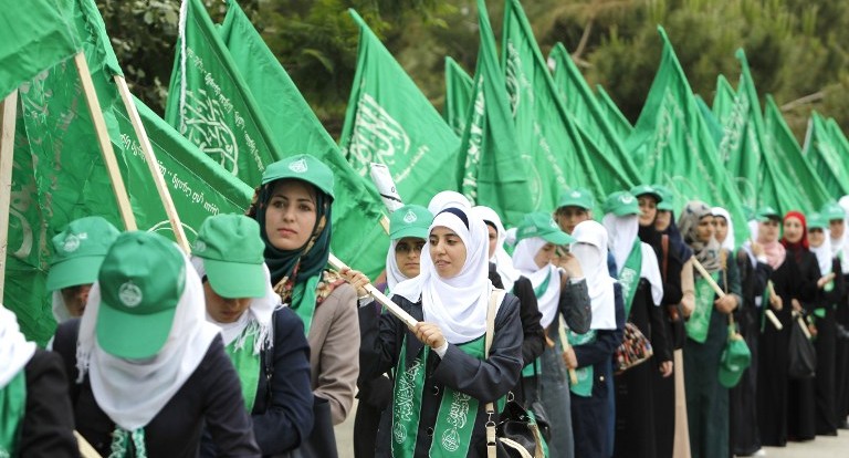 Palestinian supporters of the Hamas movement attend a rally prior to the student council elections at Birzeit University, on the outskirts of the city of Ramallah, Tuesday, May 6, 2014. (photo credit: Abbas Momani/AFP)