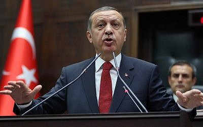 Turkey's Prime Minister Recep Tayyip Erdogan speaks during the parliamentary group meeting of Turkey's ruling Justice and Development Party in the Grand National Assembly of Turkey (TBMM) on May 13, 2014, in Ankara. (photo credit: AFP/STR) 
