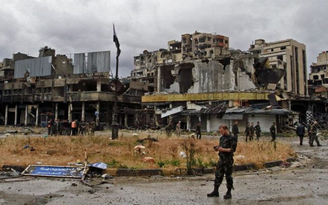 Syrian government forces inspect damage in Homs, Syria, Thursday, May 8, 2014. (photo credit: AP)