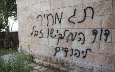 Anti-Christian graffiti reading "Price tag, David the king, Jesus Junk for the Jews" spray painted on the Romanian Church in Jerusalem on May 9, 2014. (Photo credit: Yonatan Sindel/Flash90)