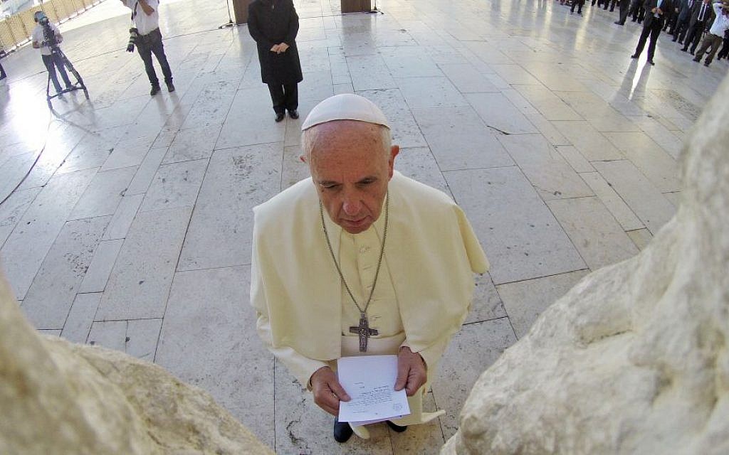 Pope Francis seen praying in front of the Western Wall, the holiest site where Jews can pray, in Jerusalem's Old City, on May 26, 2014. (photo credit: Kobi Gideon/GPO/Flash90)