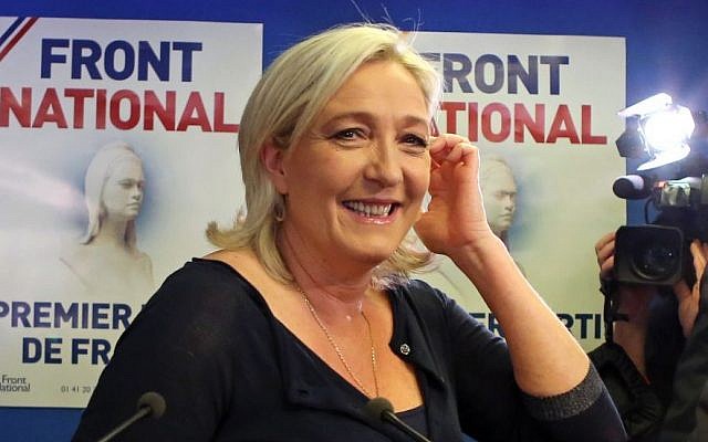 Far right party National Front leader Marine Le Pen poses for photographers before addressing reporters at the party's headquarters in Nanterre, west of Paris, Sunday May 25, 2014.(Photo credit: AP/Remy de la Mauviniere)