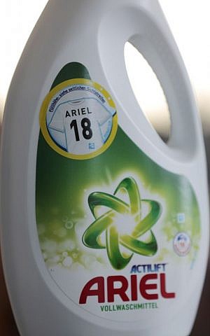 An Ariel liquid detergent bottle with an '18' on it sits in Berlin Germany, Friday, May 9, 2014. Detergent manufacturer Procter & Gamble has kicked up a froth in Germany after unintentionally placing a neo-Nazi code on promotional packages for Ariel washing powder. The use of Nazi slogans in public is banned in Germany, which neo-Nazis often try to circumvent by using codes. '18' stands for Adolf Hitler. (photo credit: AP Photo/Ferdinand Ostrop)
