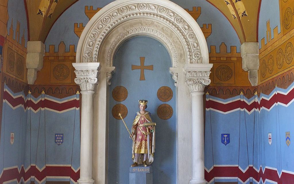 King Louis IX of France of the ill-fated Seventh Crusade in a room featuring Crusader seals and crests in the St. Louis French Hospital in Jerusalem. (photo credit: Moti Tufeld)