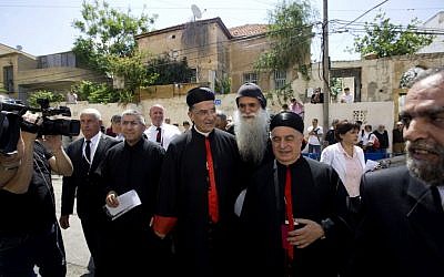 Cardinal Bechara Rai, head of the Maronite Catholic Church, center, arrives to visit a church in Jaffa, a mixed Jewish and Arab neighborhood in Tel Aviv, Israel, Monday, May 26, 2014. (photo credit: AP Photo/Sebastian Scheiner)