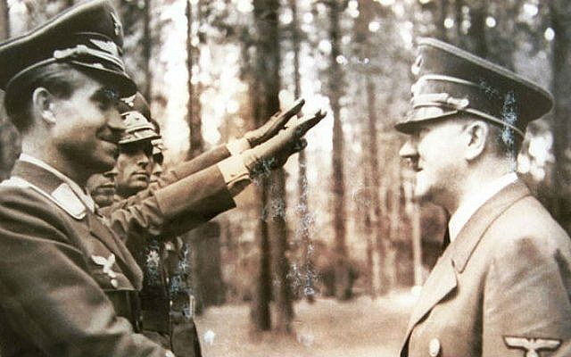 Reproduction of a photograph of Adolf Hitler receiving the Nazi salute from Israel Nazi hunter Tovia Fridman archive. (photo credit: Roni Schutzer/Flash90)