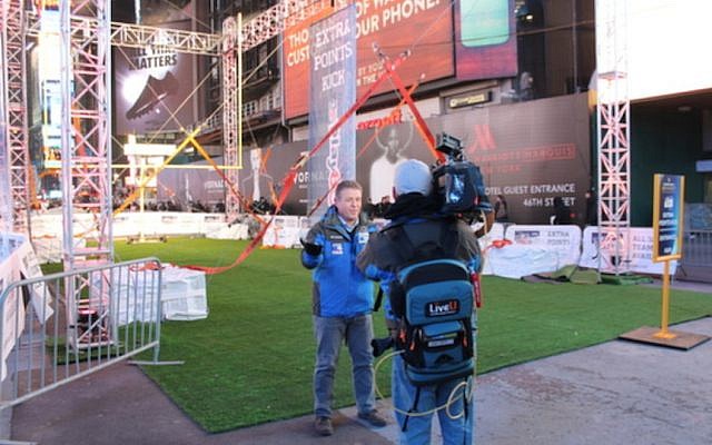 A reporter broadcasts a live TV interview 'in the field' using LiveU equipment (Photo credit: Courtesy)