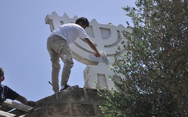 Young residents of Shfaram repair the town's ancient synagogue, in what residents say is a response to the 'price tag' attacks of Jewish extremists in the region. (photo credit: Courtesy of Shfaram Municipality)
