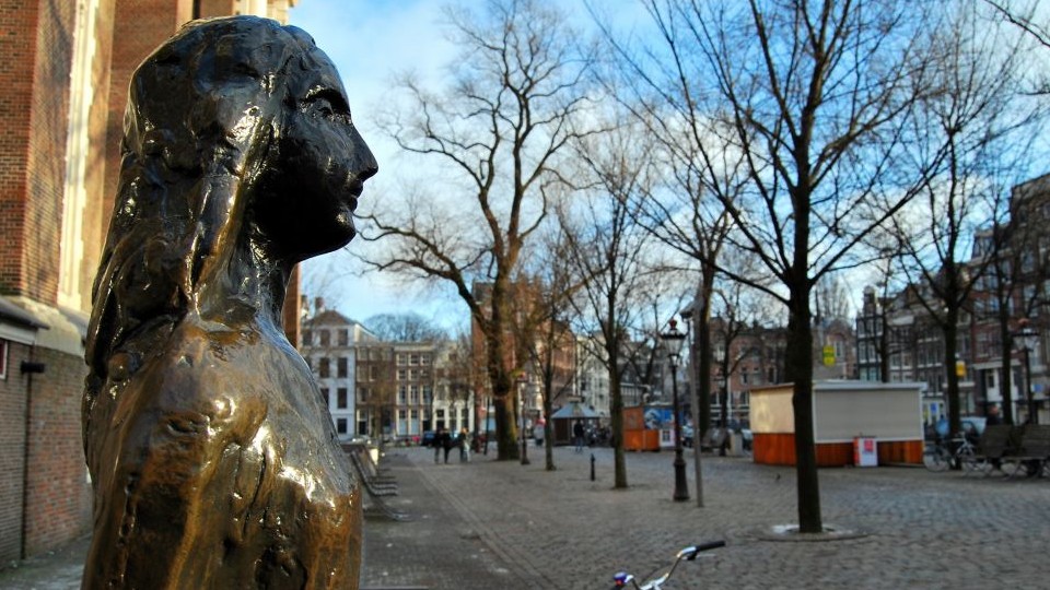Anne Frank Statue, Amsterdam, The Netherlands, Holland. (Photo credit: Anne Frank statue image via Shuttershock)