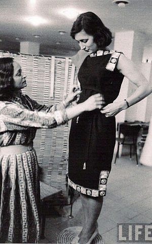 Yael Dayan, Ruth Dayan's daughter, trying on a Maskit dress (Courtesy Maskit)