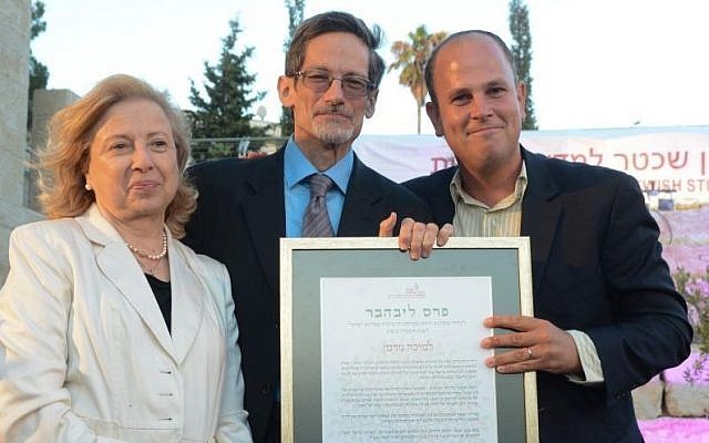 Dr. Micah Goodman (far right) accepts the Schechter Institute's 2014 Marc and Henia Liebhaber Prize for Religious Tolerance from MK Colette Avital and Prof. David Golinkin. (courtesy)