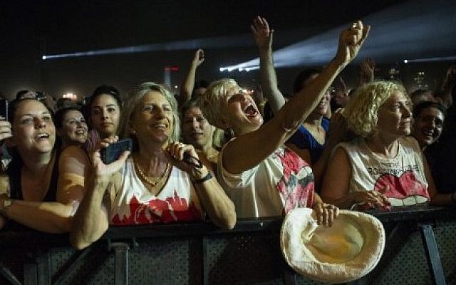 Fans cheer as The Rolling Stones perform on stage at Hayarkon Park in the Mediterranean coastal city of Tel Aviv, on June 4, 2014. (Photo credit: AFP PHOTO / JACK GUEZ)