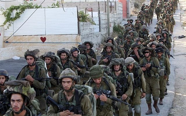 IDF soldiers in Hebron on June 17, 2014. (photo credit: AFP Photo/Hazem Bader) 
