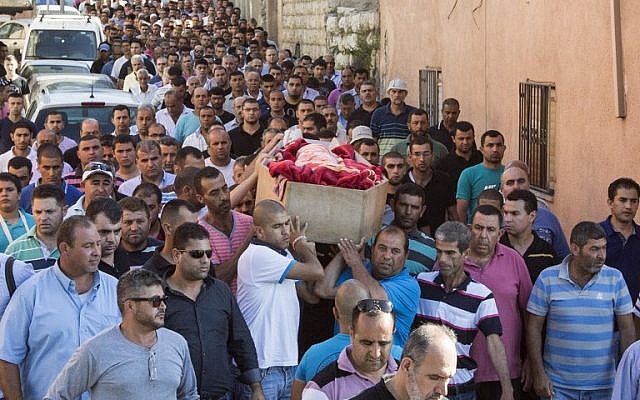 Relatives of Arab Israeli youth Mohammed Karkara,15, carry his coffin during his funeral in the northern Israeli village of Arrabe on June 23, 2014. (AFP/JACK GUEZ)