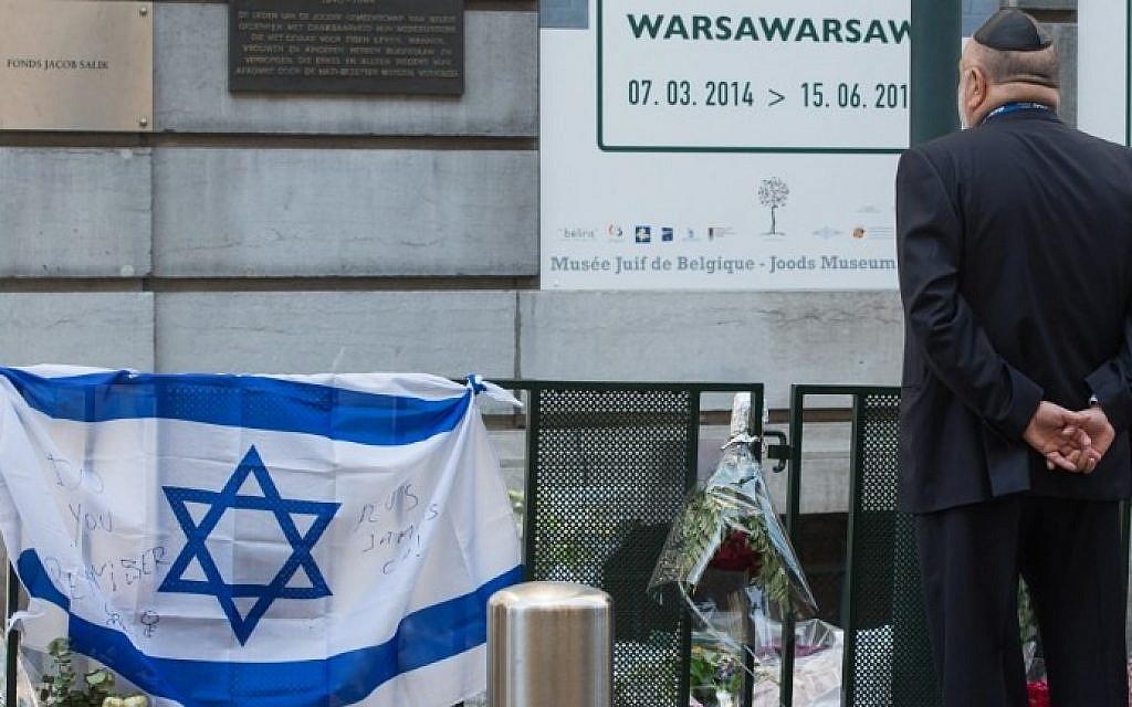 A man takes part in a solidarity ceremony of the World Jewish Congress after the killings at the Jewish museum in Brussels on June 2, 2014. photo credit: AFP/ BELGA / BENOIT DOPPAGNE)