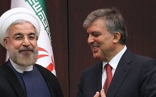 Turkish President Abdullah Gul (R) and Iranian President Hassan Rouhani speak during a press conference at the presidential palace in Ankara, on June 9, 2014. (photo credit: AFP PHOTO/ADEM ALTAN)