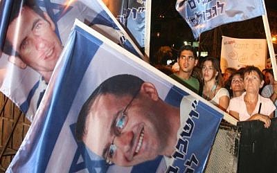 Tens of thousands of Israelis attend a 2006 rally in Tel Aviv for soldiers Ehud Goldwasser and Eldad Regev. (photo credit: Flash90)