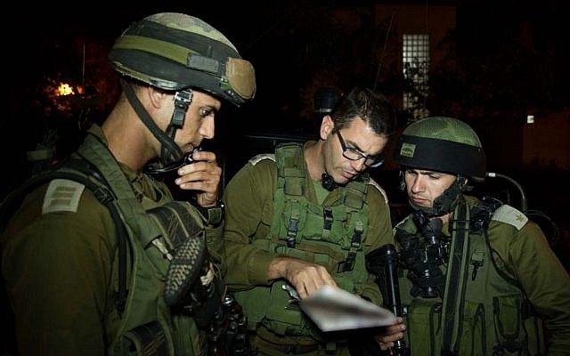 Soldiers from the IDF Kfir Brigade in the Jilazoun refugee camp, near the West Bank city of Hebron, during search efforts for three kidnapped Israeli teenagers, on June 16, 2014. (photo credit: IDF Spokesperson/Flash90)