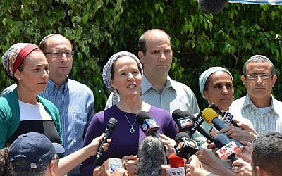 Racheli Sprecher Fraenkel, mother of kidnapped Israeli youth Naftali, speaks to the press outside her house on Tuesday, June 16, 2014. She is flanked by the parents of two other teens kidnapped with her son, Gil-ad Shaar and Eyal Yifrach. (photo credit: Yossi Zeliger/Flash90)