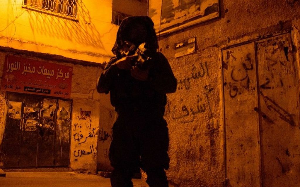 Illustrative: An Israeli soldier from the Givati Brigade searches in the refugee camp in the West Bank city of Jenin, on June 19, 2014 (IDF Spokesperson/Flash90)