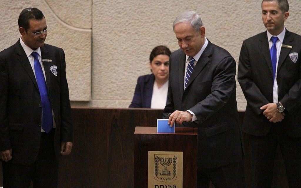 Prime Minister Benjamin Netanyahu casts his ballot for Israel's next president, in the Knesset, Tuesday, June 10, 2014 (photo credit: Knesset spokesman)