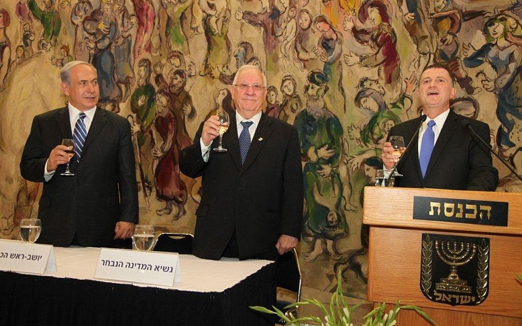 From left to right, Prime Minister Benjamin Netanyahu, President-elect Reuven Rivlin and Knesset Speaker Yuli Edelstein raise a toast after Rivlin is elected to the presidency Tuesday. (photo credit: Knesset Spokesperson)
