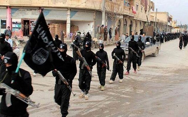 Fighters from Islamic State seen marching in their stronghold of Raqqa, Syria, June 2014. (AP/Militant Website, File)