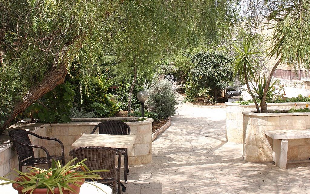 The tranquil garden of the Lutheran Hotel (photo credit: Shmuel Bar-Am)