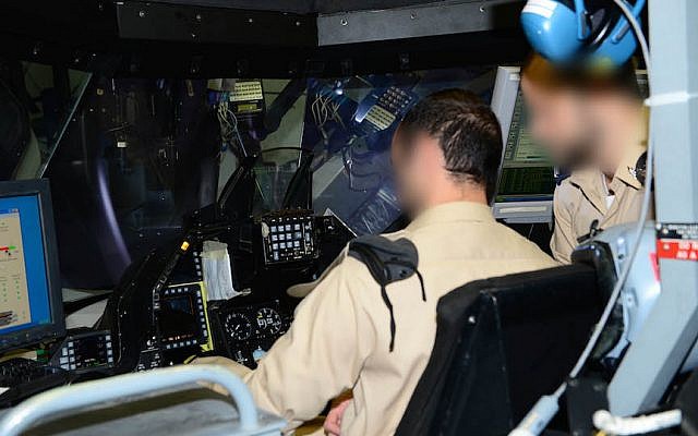 IAF officers inspect equipment in a plane set to be refurbushed by Base 108 personnel. Faces are blurred for security reasons  (Photo credit: Courtesy)
