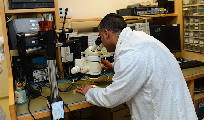 A Base 108 engineer inspects a component (Photo credit: Courtesy)