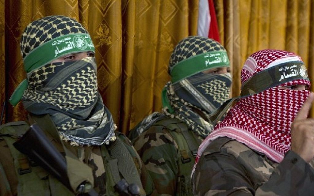 Abu Ubeida (right), the official spokesperson of the Izz ad-Din al-Qassam  Brigade, the armed wing of Hamas, at a press conference on July 3, 2014, in Gaza City (photo credit: AFP/Mohammed Abed)