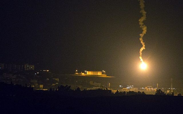 Illustrative: A picture taken from the southern Israeli border with the Gaza Strip shows Israeli flares illuminating the Palestinian coastal enclave, on July 7, 2014. (AFP/JACK GUEZ)