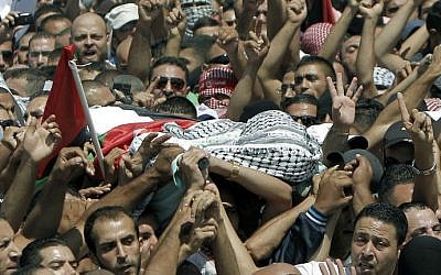 Relatives and friends of Mohammed Abu Khdeir, 16, carry his body to the mosque during his funerals in Shuafat, in israeli annexed East Jerusalem on July 4, 2014 (photo credit: AFP/ Thomas Coex)